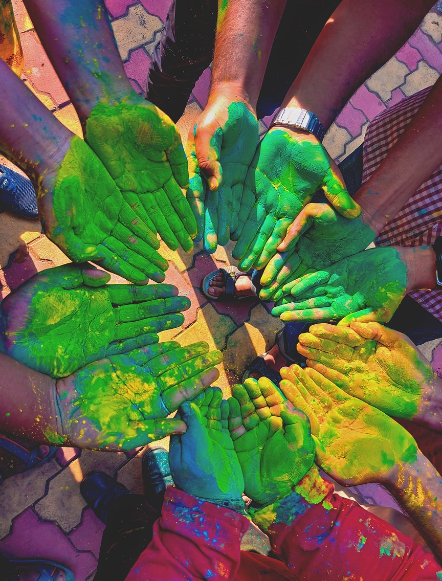 group of hands with color paint